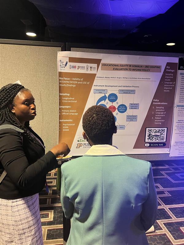Picture of Christiana Akande at AEA poster presentation